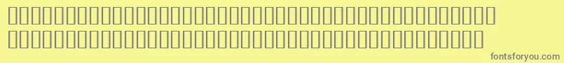 BulmerMtRegularExpertItalic-fontti – harmaat kirjasimet keltaisella taustalla