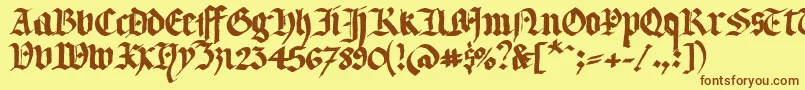 フォントLlterg – 茶色の文字が黄色の背景にあります。