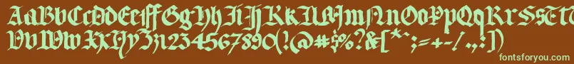 フォントLlterg – 緑色の文字が茶色の背景にあります。