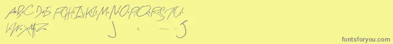 フォントArtySignature – 黄色の背景に灰色の文字