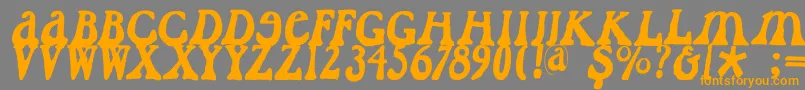 フォントCaslondadaesque – オレンジの文字は灰色の背景にあります。