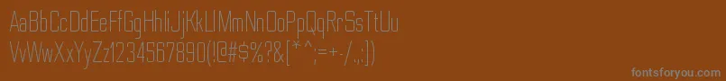 フォントNesobritecdltRegular – 茶色の背景に灰色の文字