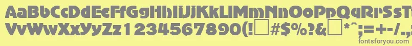 AdvertisersgothicRegularDb-fontti – harmaat kirjasimet keltaisella taustalla