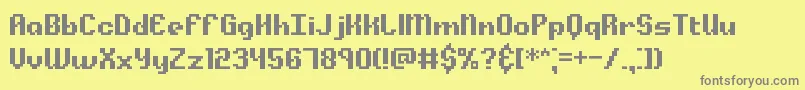フォントAlphaBetaBrk – 黄色の背景に灰色の文字