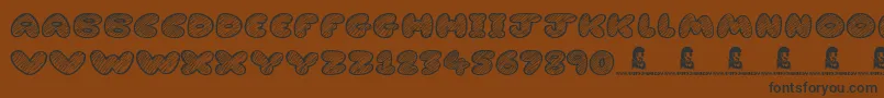 CartoonMadness Font – Black Fonts on Brown Background