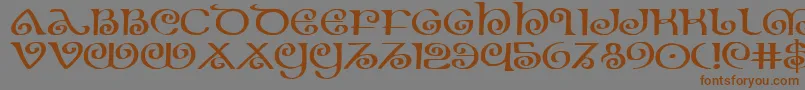 フォントTheshireexp – 茶色の文字が灰色の背景にあります。