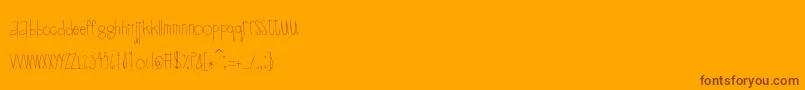 Scrapbuckets-Schriftart – Braune Schriften auf orangefarbenem Hintergrund