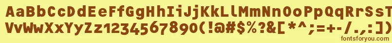 フォントOcrfBoldosfc – 茶色の文字が黄色の背景にあります。