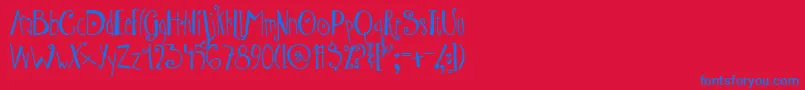 AustieBostWibbly-Schriftart – Blaue Schriften auf rotem Hintergrund