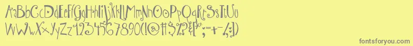 AustieBostWibbly-Schriftart – Graue Schriften auf gelbem Hintergrund