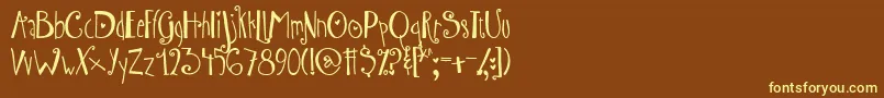 AustieBostWibbly Font – Yellow Fonts on Brown Background