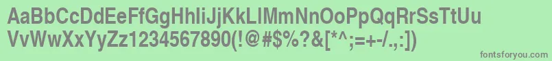 HelveticaLtNarrowBold-fontti – harmaat kirjasimet vihreällä taustalla