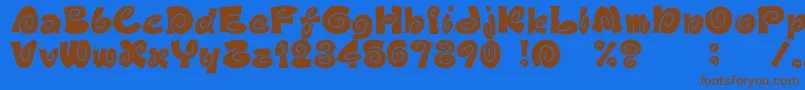 フォントD3Spiralism – 茶色の文字が青い背景にあります。