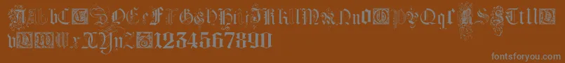 Шрифт KidnappedAtGermanLandsFour – серые шрифты на коричневом фоне