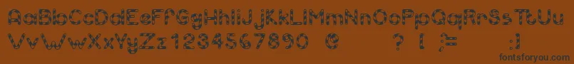 Candcu Font – Black Fonts on Brown Background