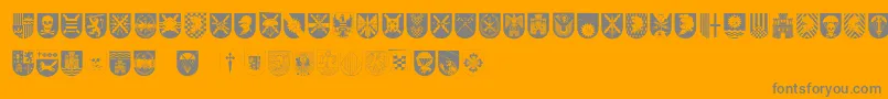 SpanishArmyShields-fontti – harmaat kirjasimet oranssilla taustalla