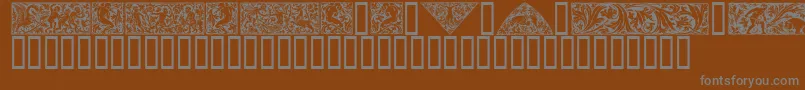 Czcionka Woodcut1 – szare czcionki na brązowym tle
