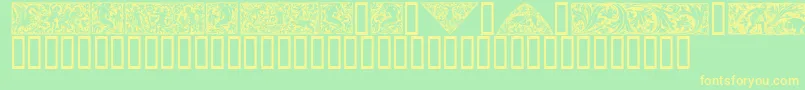 Woodcut1-fontti – keltaiset fontit vihreällä taustalla
