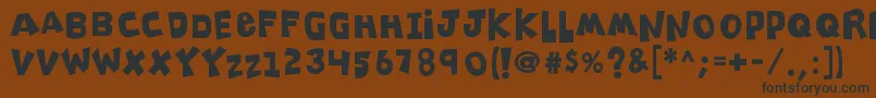 K26clippitysnippity Font – Black Fonts on Brown Background