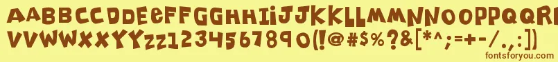 K26clippitysnippity-Schriftart – Braune Schriften auf gelbem Hintergrund