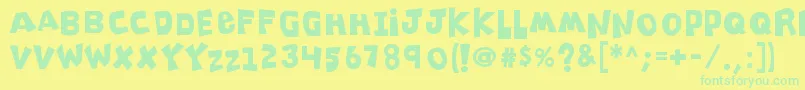 K26clippitysnippity Font – Green Fonts on Yellow Background