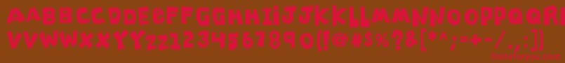 K26clippitysnippity Font – Red Fonts on Brown Background