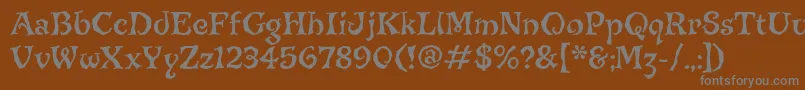 JiggerypokeryitcTt-Schriftart – Graue Schriften auf braunem Hintergrund