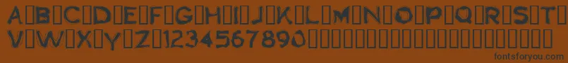 フォントBoogaloo1.0 – 黒い文字が茶色の背景にあります