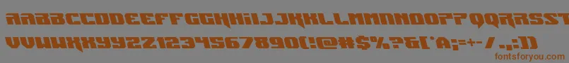 フォントJumpersleft – 茶色の文字が灰色の背景にあります。