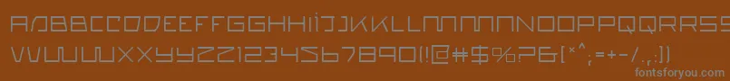 Quasitron-fontti – harmaat kirjasimet ruskealla taustalla