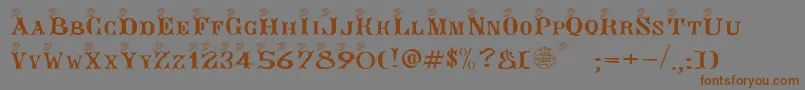 フォントAngegardien – 茶色の文字が灰色の背景にあります。