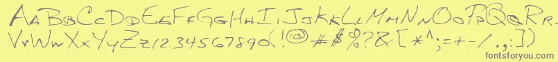 フォントMkumbaRegular – 黄色の背景に灰色の文字