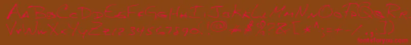 MkumbaRegular Font – Red Fonts on Brown Background