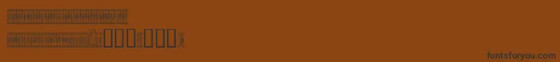 Czcionka Sardinescanned – czarne czcionki na brązowym tle