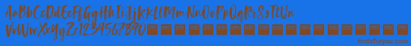 Fonte LuckyTurnsDemo – fontes marrons em um fundo azul