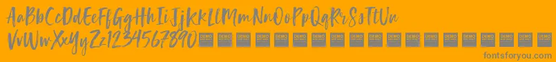 LuckyTurnsDemo-Schriftart – Graue Schriften auf orangefarbenem Hintergrund