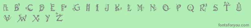 フォントEroticapssolid – 緑の背景に灰色の文字