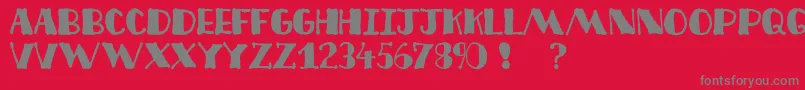 Decofree-fontti – harmaat kirjasimet punaisella taustalla