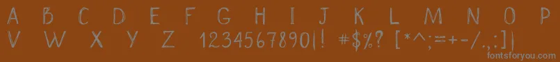 Czcionka Scrawnynorah – szare czcionki na brązowym tle
