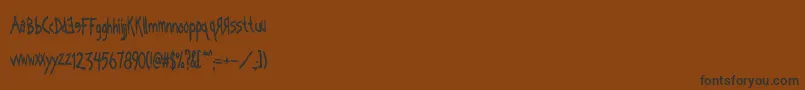 Kornography Font – Black Fonts on Brown Background