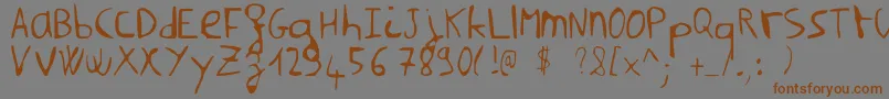NilmsaHard Font – Brown Fonts on Gray Background