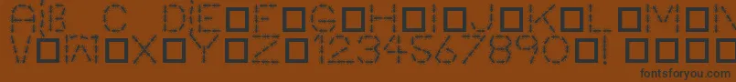 Antpile Font – Black Fonts on Brown Background