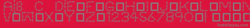 Fonte Antpile – fontes cinzas em um fundo vermelho