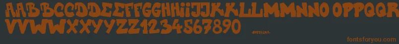 Upstairscvjmgraff-fontti – ruskeat fontit mustalla taustalla
