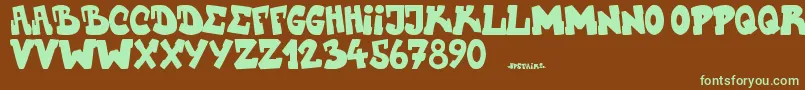 Upstairscvjmgraff-fontti – vihreät fontit ruskealla taustalla