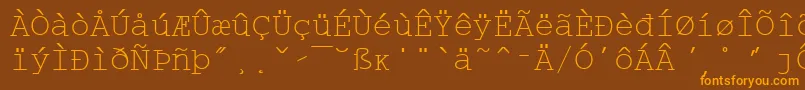 フォントWpMultinationalaCourier – オレンジ色の文字が茶色の背景にあります。