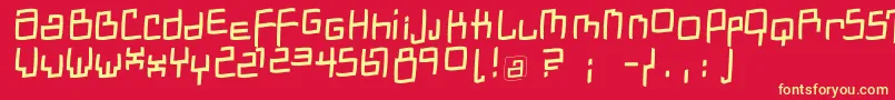 フォントDadastracesfreeshapesItalic – 黄色の文字、赤い背景