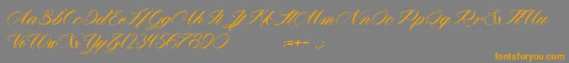 フォントMathildaInWonderland – オレンジの文字は灰色の背景にあります。