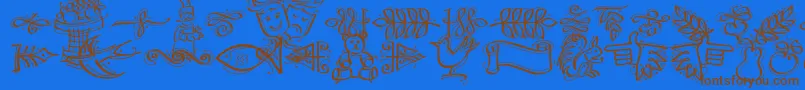 DfCalligraphicOrnamentsLetPlain.1.0 Font – Brown Fonts on Blue Background