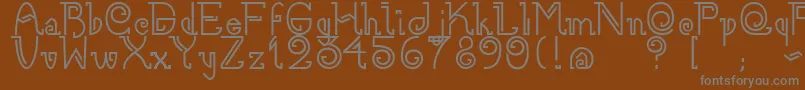 フォントNee – 茶色の背景に灰色の文字